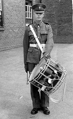 BB06p2.jpg - John Bassindale * ??? - † 12 November 2007 Corps of Drums - ca. 1957 John Bassindale is third from the left middle row. Any details, memories or photographs that you may have would be most welcome.