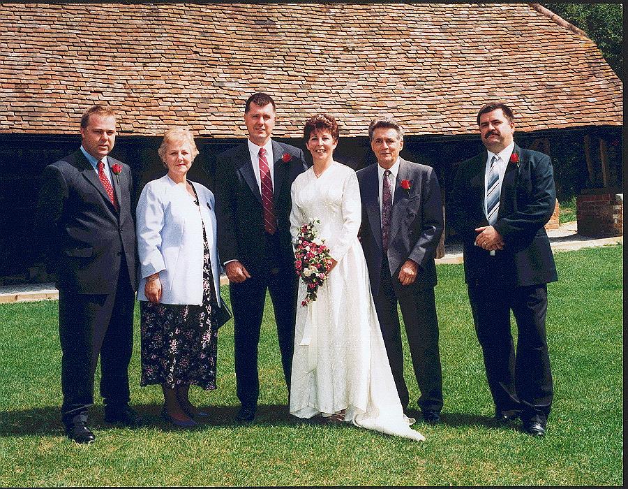 BI001p4.jpg - Thomas Robert (Bob) Izzard Wedding Group. Mrs. Barbara Izzard, Bob's Mother sent us these wedding photos and wrote: Family wedding group Jim ( the groom ) Bob's eldest brotherwho used to be in the R.A.F. has now rejoined the Territorials. Bob is the one with the moustache. Any details, memories or photographs that you may have would be most welcome.