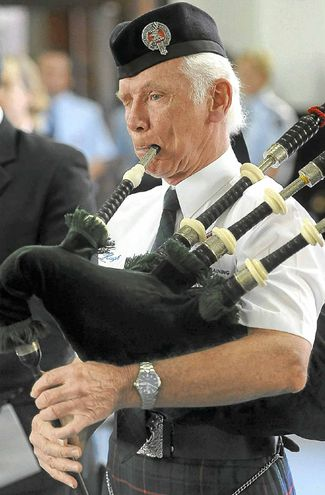 BK013p4.jpg - Hugh Macdonald KAY *6th April 1940 - †13th March 2012 Hugh playing the bagpipes.