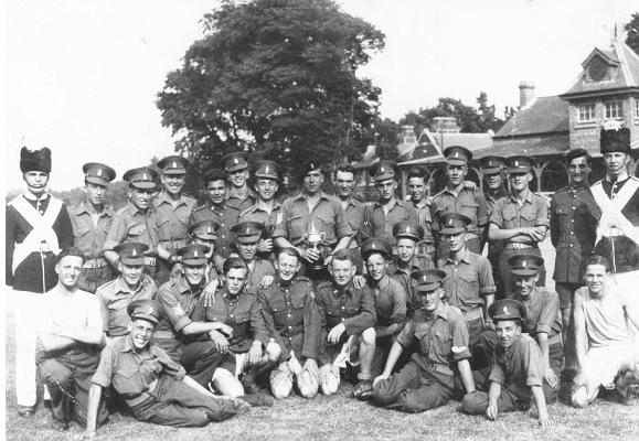 BM002p4.jpg - 22292288 Sgt Bill Morris This photograph was sent to Bob by Bill Morris's daughter. It shows a group of lads, including Bill, on the Haslar Sports field sometime in 1951 Close-ups of this photo can be seen in our Photo Gallery Album 1951-54  Any details, memories or photographs that you may have would be most welcome.