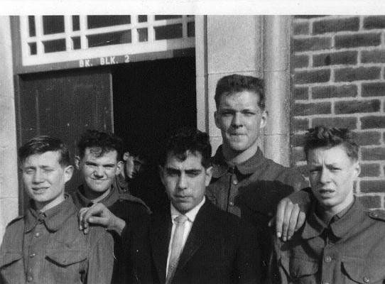 61630141.jpg - Harold Joseph P. NASH 23881128 * 16th. February 1946 - † 30th. August 1999 Here you can see why Harold was nicknamed "Lofty". The photo shows Richard Bond, Brian Wright, ?, Jack ???, “Lofty” & Peter “Sammy” Laycock. The photo is taken from the 1960-63 Album (61630141) of our photo-gallery  I knew Lofty in Hill Platoon between '62 & '63 when he left, a real gentle giant. The memories of Lofty I have are nearly all recalled with a smile and a chuckle; like the memory of trying to have a wash standing next to him in the ablution block. He took up so much room you had to have a wash leaning away from his shoulders and he liked to admire himself in the mirror, so it was no good waiting for him to leave!  His wicked sense of humour when he would nick kit (which the unsuspecting JL would leave out on his bed), put it in his suitcase and then return it when the panic-stricken JL thought he had to go "diffy" of the item; oh how Lofty laughed as a stream of abuse came at him from his victims.  I remember finding some brush or other missing from my locker and went straight up to him demanding its return "or else"; what a joke he could have thrown me out of the window with one hand if he wanted to. He was the only man I ever saw lift a SLR up with an extended arm, holding only the flash-hider. He even did it with a SLR in each hand at the same time. He also "sorted-out" a bullying J/Sgt in front of the platoon, in the spiders during a winter drill session. The J/Sgt was busted down & Lofty wasn't touched; justice works sometimes. A great lad, funny and easy going I can only imagine how his family & friends are missing him.   Farewell Lofty mate. J/Pte Middleton J. 24/5/2011  Any details, memories or photographs that you may have would be most welcome.